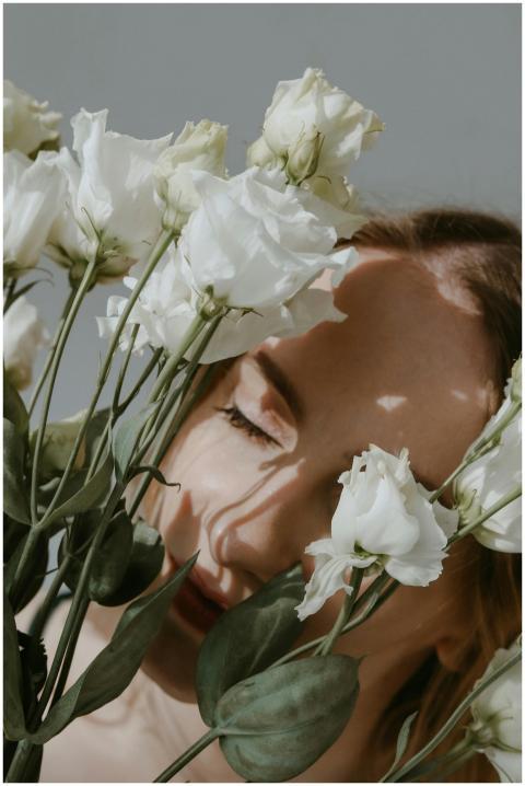 A serene portrait of a woman with closed eyes amon