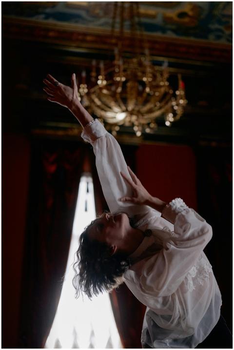 Graceful dancer in elegant attire captured mid-per