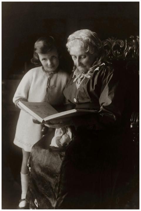 A heartwarming vintage photo of a grandmother read