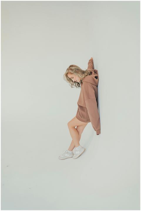 Minimalist fashion portrait of a young woman in a