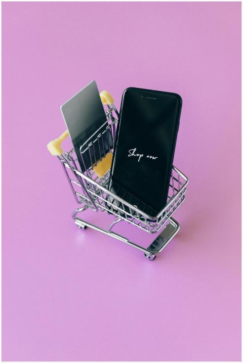 Modern shopping concept featuring smartphone and c