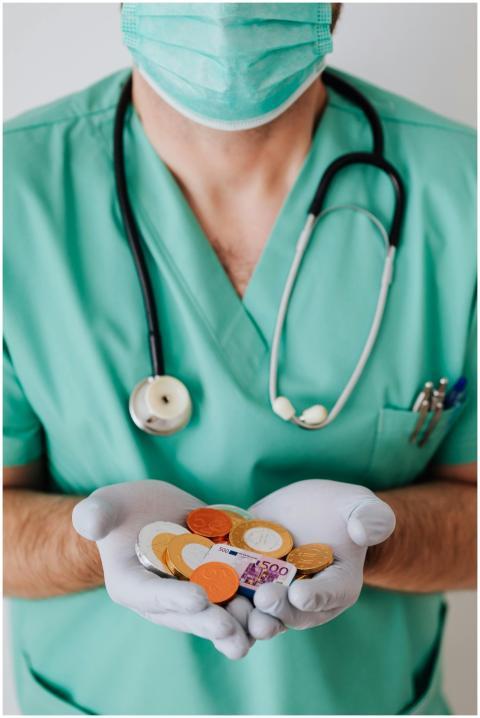 Anonymous male doctor wearing medical uniform mask