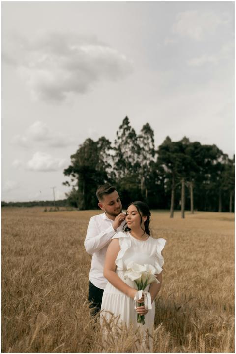 Couple in love embracing in a serene wheat field,