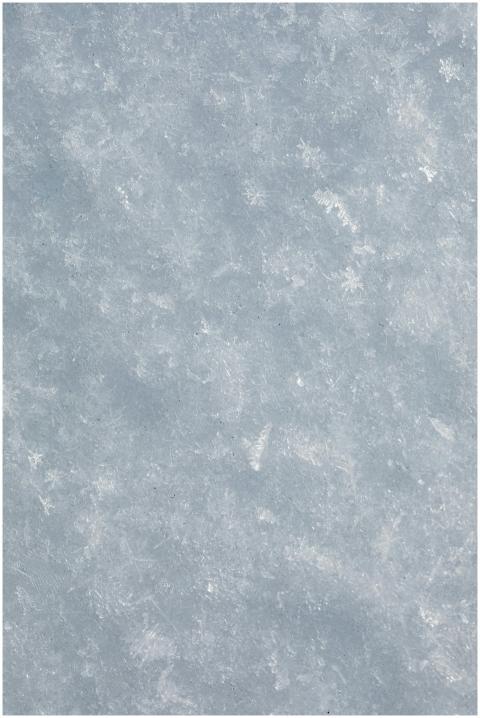 Close-up view of a frosty snow surface, showcasing
