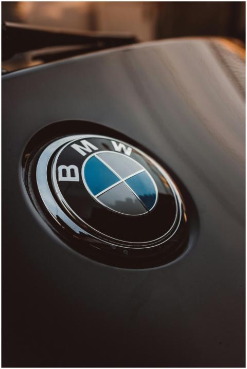 Close-up of a shiny BMW logo on a luxury car, emph