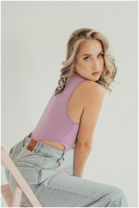 Elegant portrait of a woman in a lavender top and
