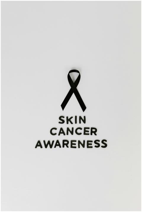 Black ribbon symbolizing skin cancer awareness on