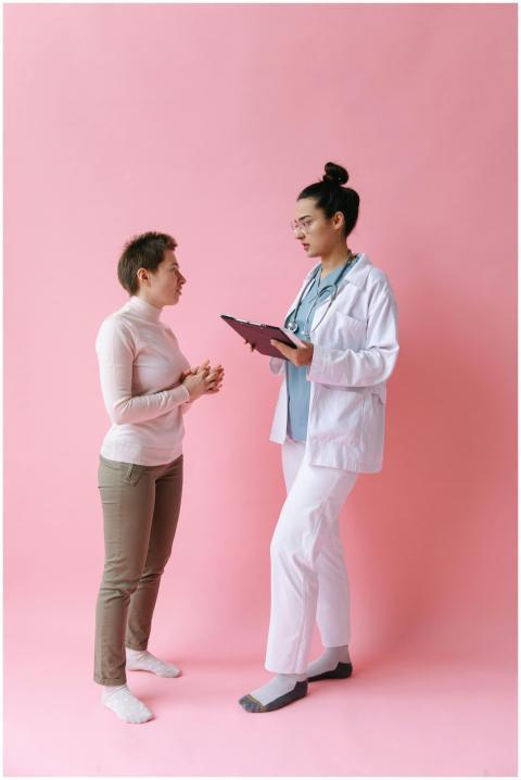 A medical professional consulting with a patient,