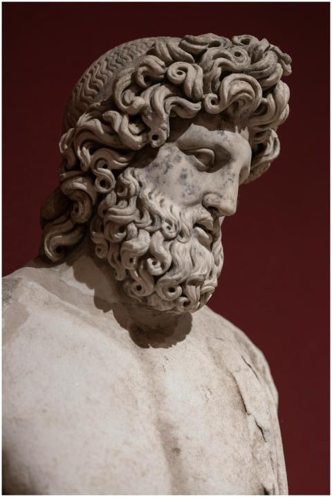 Close-up of an ancient marble statue depicting a G