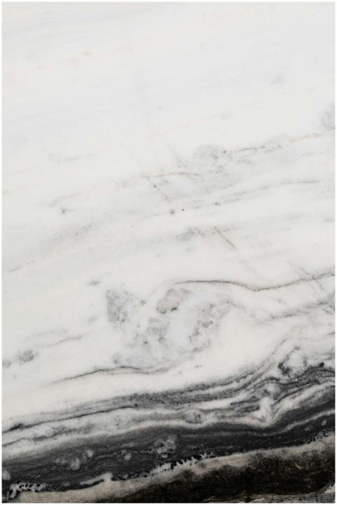 Close-up view of a white marble surface adorned wi