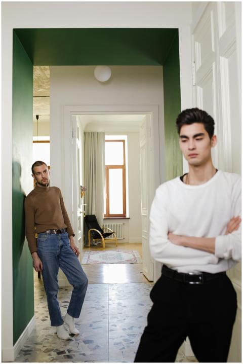 Contemplative interracial couple in a stylish home