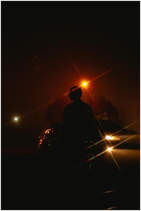 A captivating silhouette of a man at night, illumi