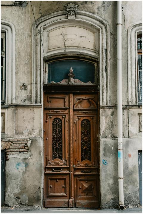Intricately carved vintage wooden door on a histor