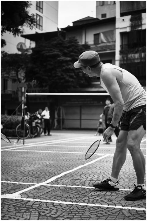 Black-and-white photo of a street tennis game in V