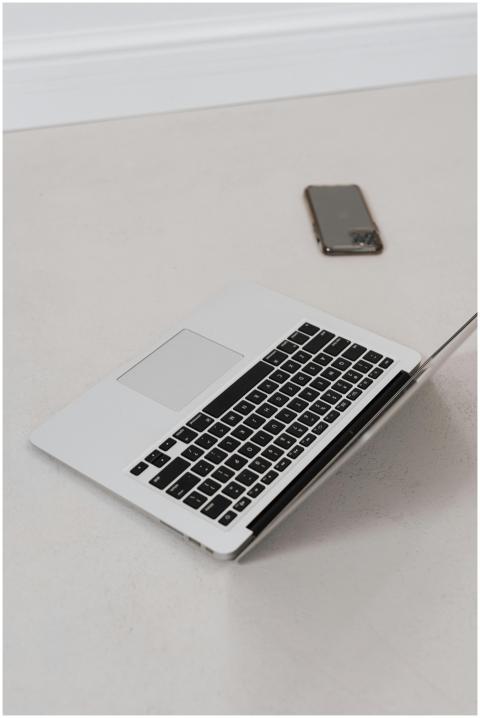 Aerial view of a sleek laptop and smartphone on a