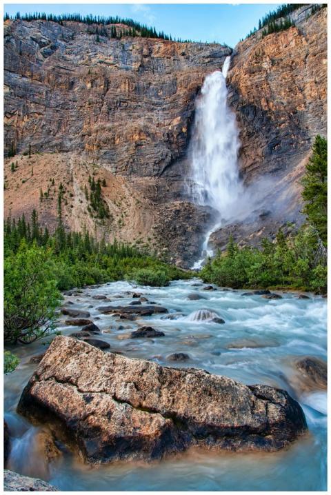 Stunning waterfall cascading down cliffs in Yoho N