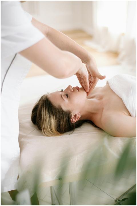 Woman enjoys a soothing facial massage in a serene