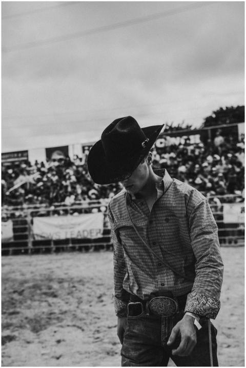 Captivating portrait of a cowboy at a lively rodeo
