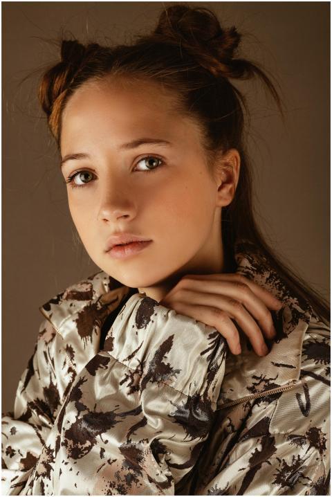 Portrait of a fashionable young model posing with