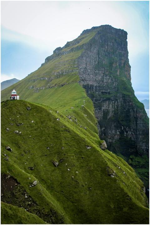 Stunning view of Klakkur Mountain's green cliffs i