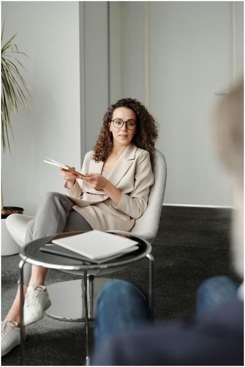 A professional woman in an office setting conducti