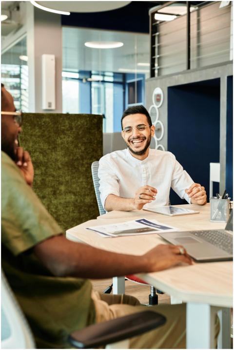 Two young professionals discussing business ideas