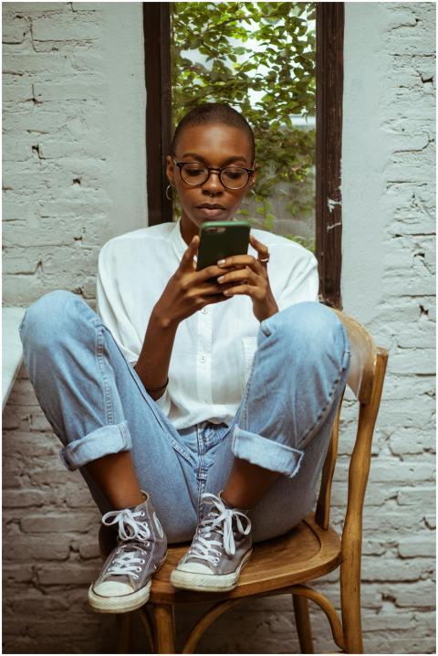 Full length of young black concentrated female in