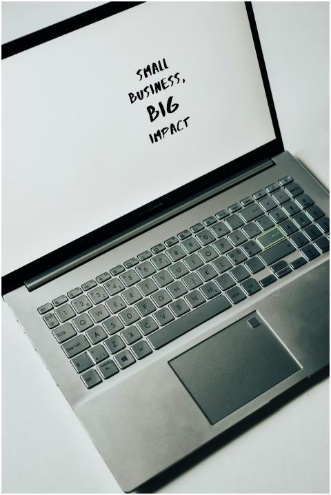 A laptop screen with the text 'Small Business, Big