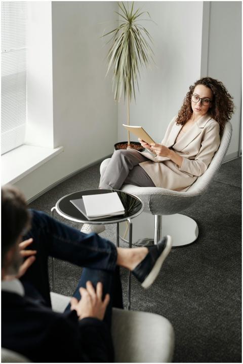 A professional woman conducting a business meeting