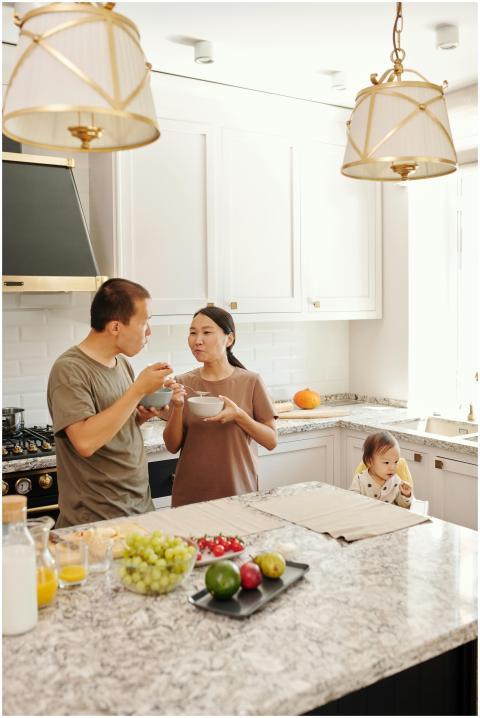 Asian couple and baby dining together in a contemp