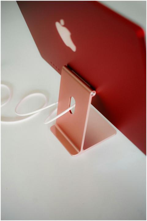 Minimalist view of a red desktop computer from beh