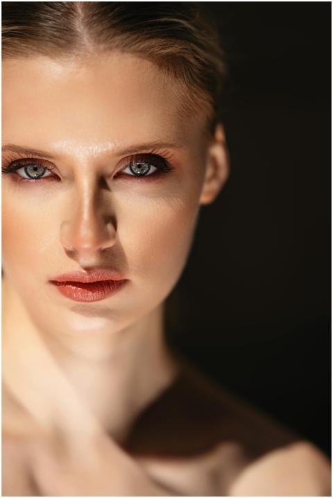 Close-up portrait of a female model with striking