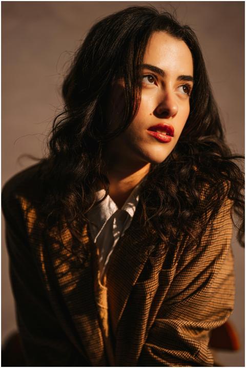Studio portrait of a thoughtful woman looking asid