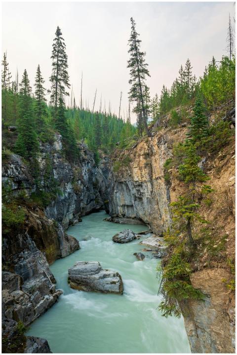 Serene river flowing through a picturesque canyon