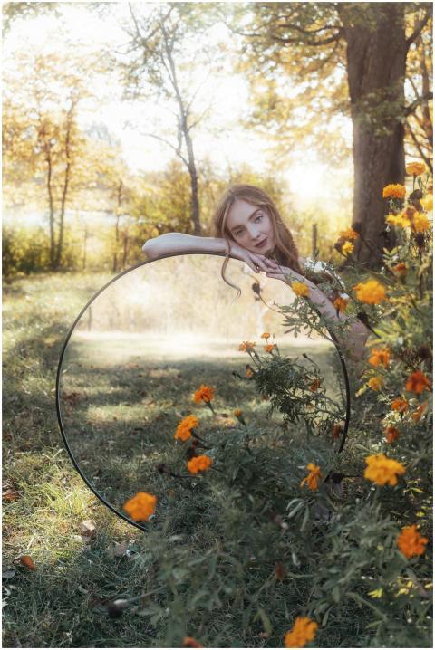 Dreamy portrait of a woman with mirror reflection