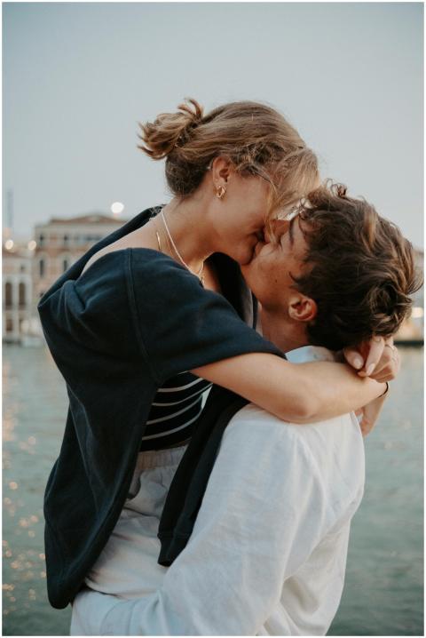 Romantic moment captured as a couple kisses by the