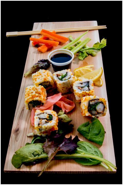 Vibrant sushi platter with fresh vegetables and so