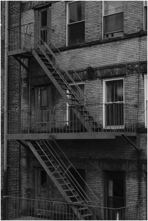 Monochrome image of classic New York fire escape o