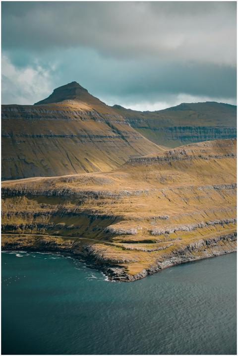 Breathtaking view of layered mountains and ocean o