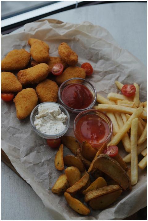 Tasty assortment of fried food including nuggets,