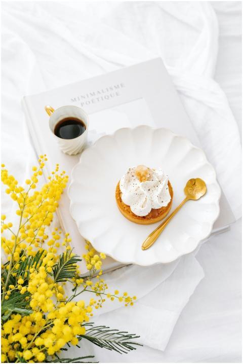 Delicate pastry paired with a golden spoon, mimosa