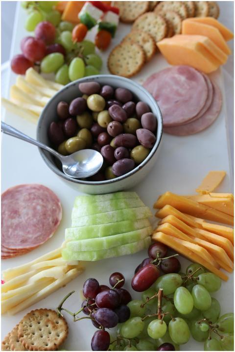 A beautifully arranged charcuterie board featuring