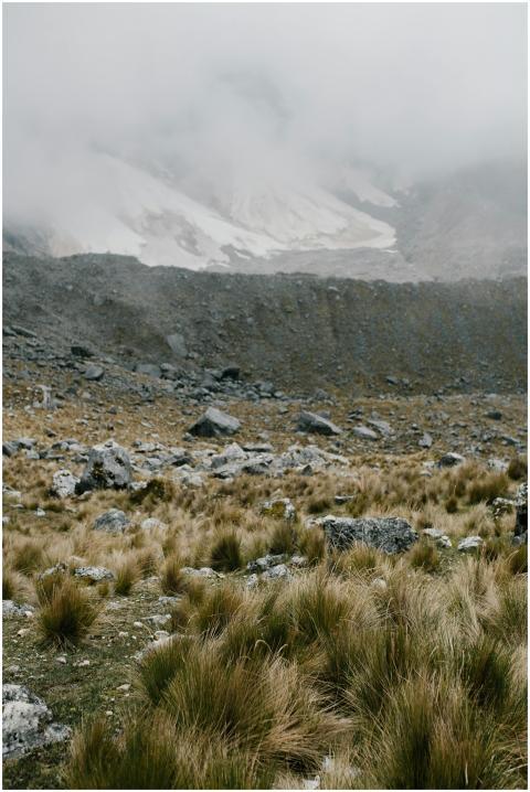 A foggy mountain landscape in Peru with rocks and