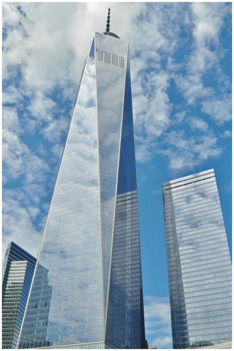 A striking view of One World Trade Center reflecti