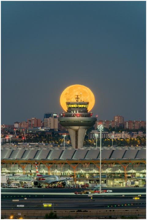 Stunning night shot of the full moon rising over t