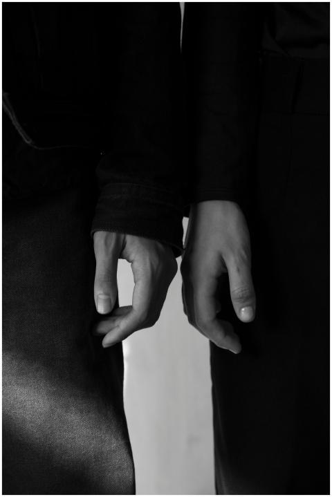 Elegant black and white photo of two touching hand