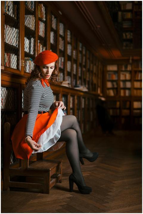 Chic woman in vibrant outfit posing elegantly in a