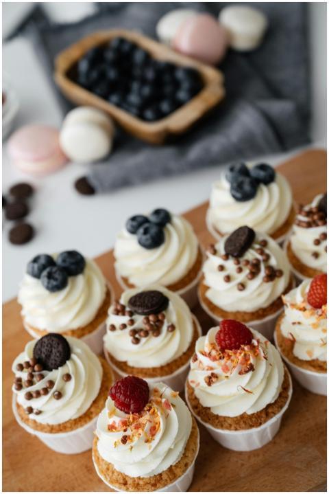 From above of delicious sweet cupcakes with cream