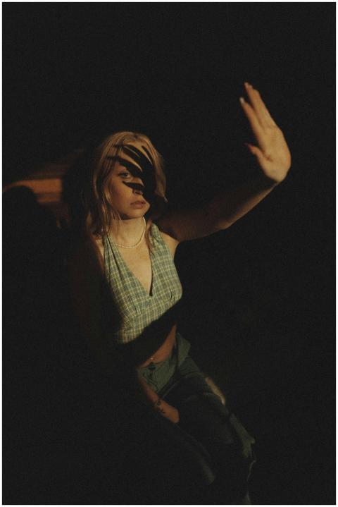 Dramatic portrait of a woman posing with light and