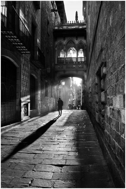 A striking black and white scene of a person walki